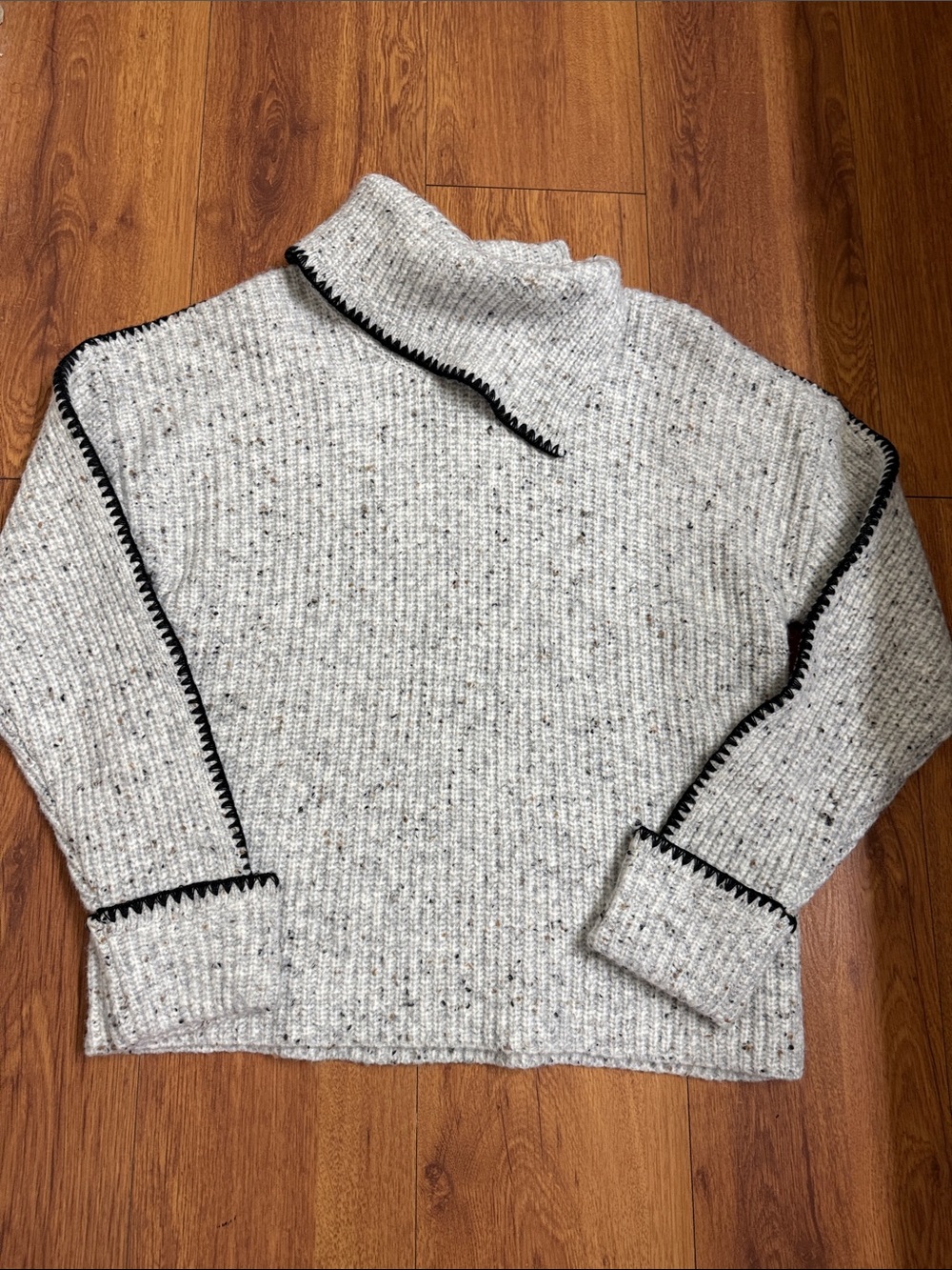 Cozy Speckled Cream Cowl Neck Sweater with Black Contrast Trim